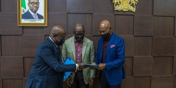 •*L-R: Attorney General and Commissioner for Justice, Oluwole Iyamu SAN; Edo State Governor, Mr. Godwin Obaseki, and Chairman, Zinox Technology Limited, Mr. Leo Stan Ekeh, after the government entered an agreement with the management of Zinox Technology Limited for the provision of laptops in support of the transformation of the Edo State Civil and Public Service, at the Government House, in Benin City.