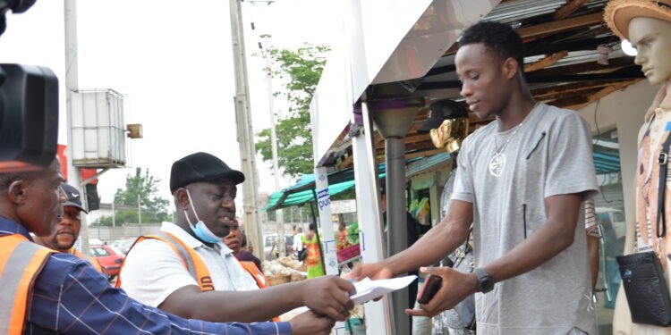 •Officials of Edo Ministry of Physical Planning and Urban Development, issuing contravention and demand notices to the owner of a property that is illegally converted to commercial use in the Benin metropolis.