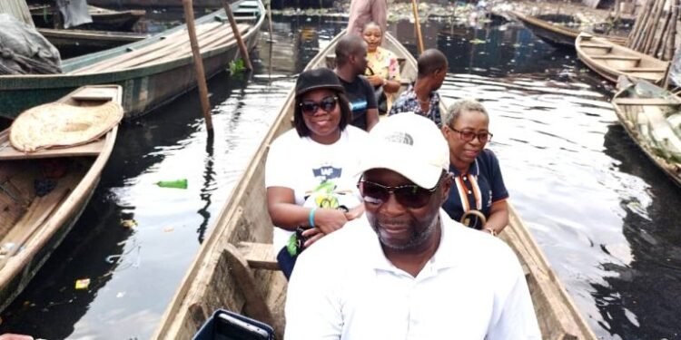 •The UK Charity, IA-Adeagbo Foundation officials and some Makoko residents in a boat