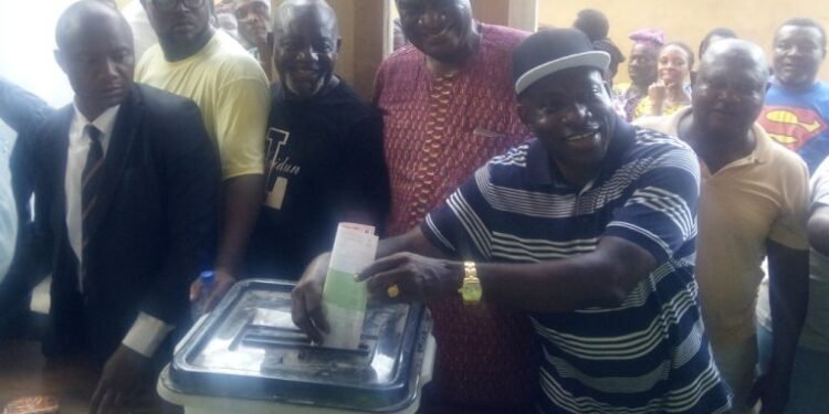 *Prof. Chukwuma Soludo (2nd r) casting his vote at about 5.10p.m at Isuofia Ward 13, Unit 002 in Aguata Local Government Area, after waiting for over five hours.