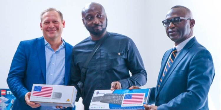 •Stephen Ibelli, Public Affairs Officer, U.S. Consulate and Jika Attoh, Executive Director, WABMA presenting equipment to Wazobia FM office