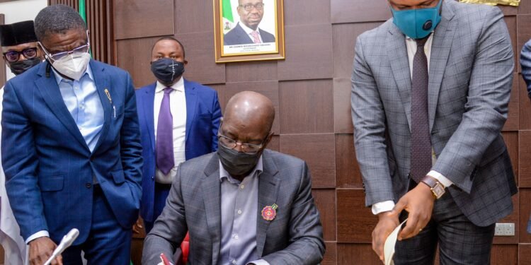 ••Edo State Deputy Governor, Rt. Hon. Comrade Philip Shaibu; Governor Godwin Obaseki, and Speaker, Edo State House of Assembly, Rt. Hon. Marcus Onobun, at the signing of the 2022 Budget, at the Government House in Benin City, on Wednesday, December 22, 2021.