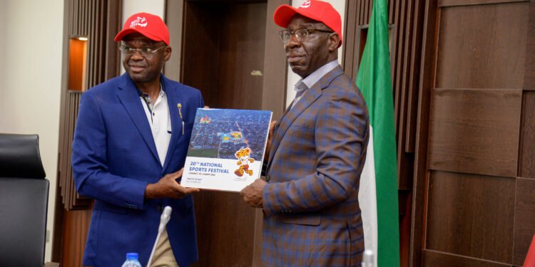 ••Edo State Deputy Governor (left), presenting the 20th National Sport Festival Report to the Edo State Governor, Mr. Godwin Obaseki (right), at the Government House in Benin City, the Edo State capital.