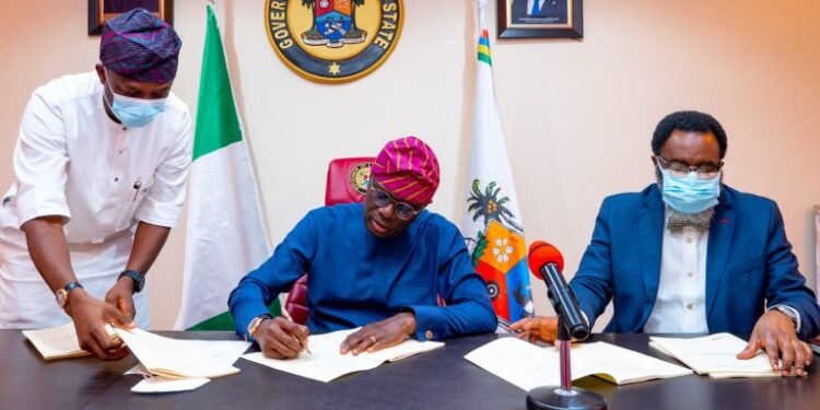 •Lagos State Governor, Mr Babajide Sanwo-Olu, signing bills upgrading the Lagos State Polytechnic (LASPOTECH), Adeniran Ogunsanya College of Education (AOCOED) and Michael Otedola College of Primary Education (MOCPED) to universities, flanked by his Special Adviser on Education, Mr Tokunbo Wahab (left) and the Attorney-General/Commissioner for Justice, Mr Moyosore Onigbanjo, SAN, at the Lagos House, Marina, on Wednesday, Feb. 2.