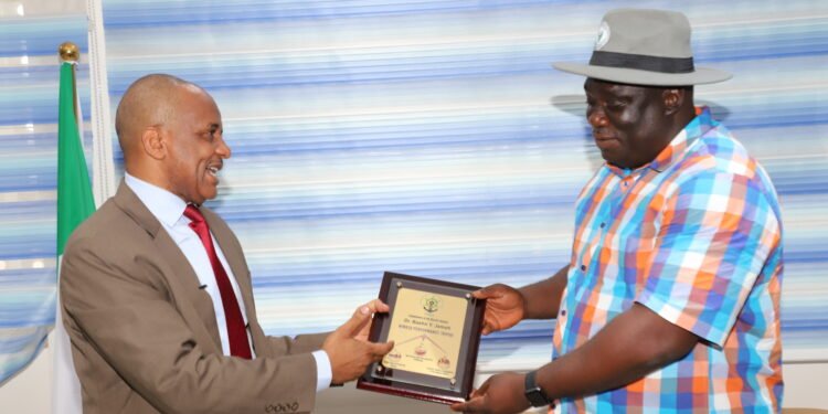•Director General, Nigerian Maritime Administration and Safety Agency (NIMASA), Dr. Bashir Jamoh presenting a plaque to the President, Barge Operators Association of Nigeria (BOAN) Hon. Bunmi Olumekun when the latter led the association on a courtesy visit to the Agency recently.