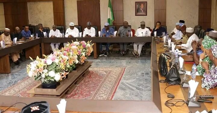 •The Council members in session.