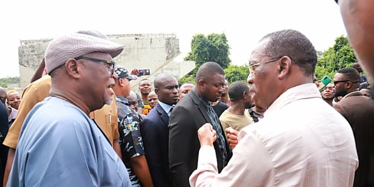 •Delta Governor Senator Dr. Ifeanyi Okowa (right) discussing with Chief Jerry Ossai one of the leaders of Isheagu community during the Governor's inspection of the ongoing construction of the Bridge across Mgbalamgba river connecting Isheagu and Ewulu Communities in Aniocha South LGA on Friday. PIX: SAMUEL JIBUNOR