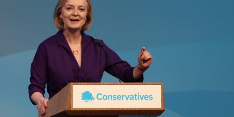 •Liz Truss delivers a speech at an event to announce the winner of the Conservative Party leadership contest [Adrian Dennis/AFP]