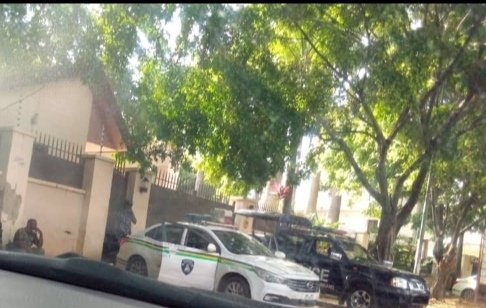 •Police vehicles positioned at the entrance of the LMC office in Abuja on Thursday.