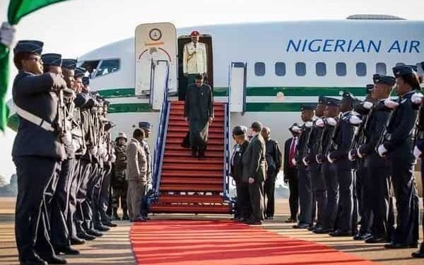 •President Muhammadu Buhari...stepping down from the plane