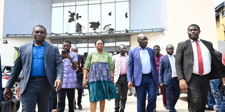 •FILE: Edo State Governor, Mr. Godwin Obaseki (2nd right) during an on-the-spot assessment of a bank damaged during the violent protests in Benin City, on Thursday, February 16, 2023.