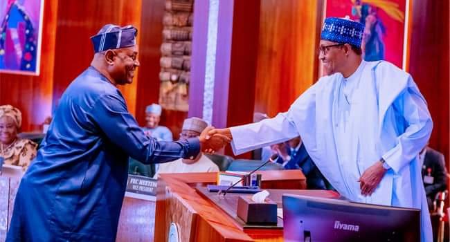 *President Muhammadu Buhari in a warm handshake with Solomon Arase during the swearing-in ceremony on Wednesday in Abuja.