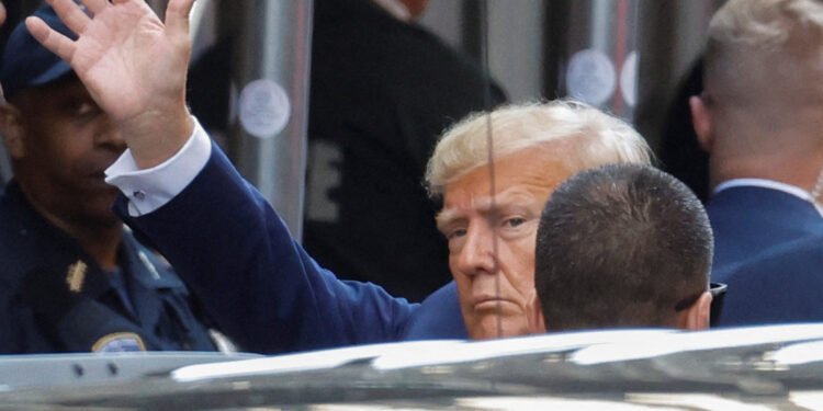 *Former U.S. President Donald Trump arrives at Manhattan Criminal Courthouse on the day of his planned court appearance after his indictment by a Manhattan grand jury following a probe into hush money paid to porn star Stormy Daniels, in New York City, U.S., April 4, 2023. REUTERS/Amanda Perobelli