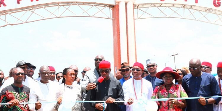 *Delta Governor, Senator Dr. Ifeanyi Okowa (3rd left) cutting the tape while Inaugurating  the Ugbolu/Akuku Igbo Road in Oshimili North LGA on Thursday. With him are Secretary to State Government, Mr. Patrick Ukah (right), Obi of Ugbolu, Anthony Nwokolo (3rd right), the Vice Chairman of the Council,  Amb. Uju Okolo (2nd left),the Permanent Secretary, Ministry of Works, Engr. Fred Edafioghor (left) and others. 
[Pix: JIBUNOR SAMUEL]