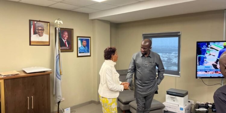 *Ms Hilda Josef, in hand-shake with Mr. Charles Ogunmola, the NDDC Executive Director (Projects).