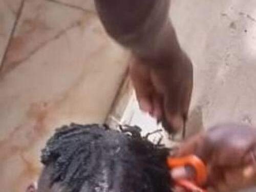 *Borno Hisbah officials in public haircut of youths