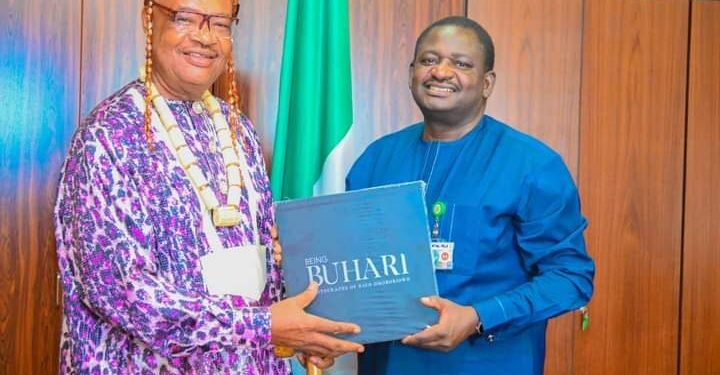 *Igwe Dr C. C Okoli (l) with Femi Adesina (r) on Friday at the presidential villa