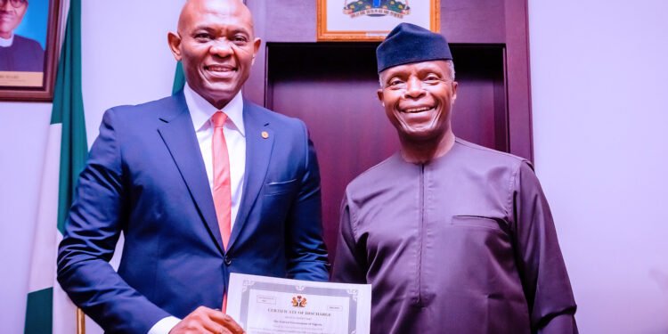 *Vice President, Professor Yemi Osinbajo (r) and Group Chairman, Transcorp Plc, Mr Tony Elumelu, during the presentation of Discharge Certificate to Transcorp Power Plc, having met and surpassed the Post-Privatisation Target set by the Federal Government on the Ughelli Power Plc (Transcorp Power Plc), acquired by Transcorp Plc, in a ceremony held at the State House, Abuja on Monday.