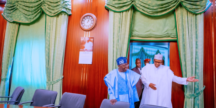 *President Muhammadu Buhari (r) taking the President-elect Bola Tinubu (l) round the Villa