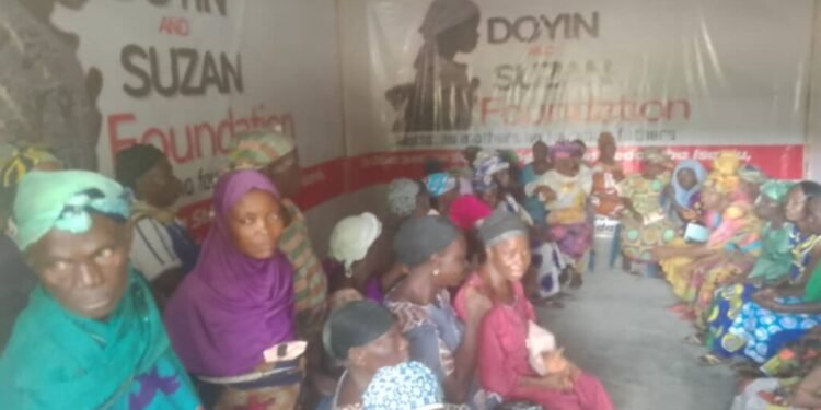 *A cross section of widows who received foodstuffs from Doyin and Susan Foundation on Monday in Isanlu, Kogi