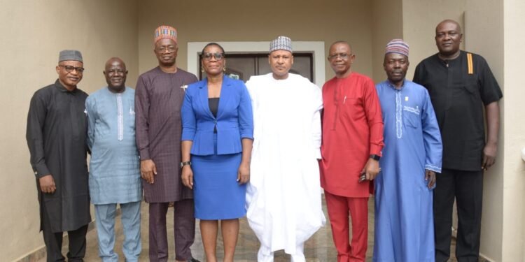 *Nigeria Minister of Information, Mohammed Idris Malagi (in white agbada), flanked by executive members of the Guild of Corporate Online Publishers (GOCOP) at his house in Abuja... Tuesday, August 22, 2023.