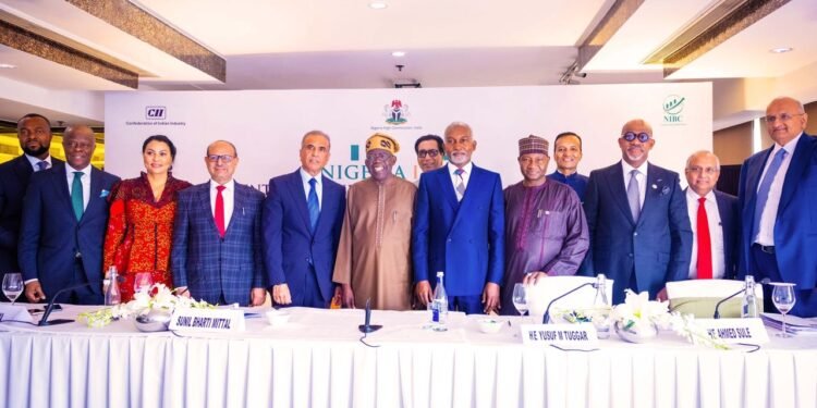 *President Bola Tinubu flanked by the Indian Investors during the Nigeria-India Summit