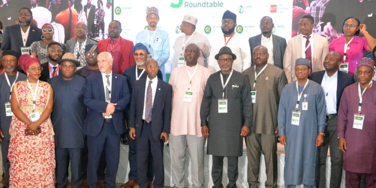 Pic. 17.  Front row: Minister of State Petroleum Resources (Oil), Sen. Heineken Lokpobiri (5th, L); Executive Secretary, Nigerian Content Development and Monitoring Board (NCDMB), Simbi Wabote (5th,R); Secretary General, African Petroleum Producers Oganisation (APPO), Dr Omar Farouk (4th, L) and other participants during the 3rd African Local Content Roundtable, in Abuja on Wednesday (25/10/23).
27694/25/10/2023/Hogan Bassey/NAN