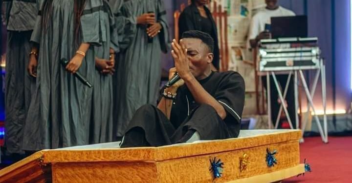 *A gospel singer, Samuel Oguche aka Onoja, rising from a coffin at an event in Jalingo, Taraba State