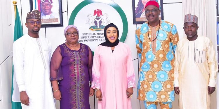 *Minister of Humanitarian Affairs and Poverty Alleviation, Dr. Beta Edu flanked by Dr. Efem (left); Protem Registrar, Dr. Kemi Ottun-Emaimo (2nd left); National Project Director, Mr. Yakubu Oni (right) and Dr. Kabiru Atta (2nd right)