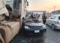 PHOTOS | Loaded Truck Crushes Car on Lagos Road | METROWATCH