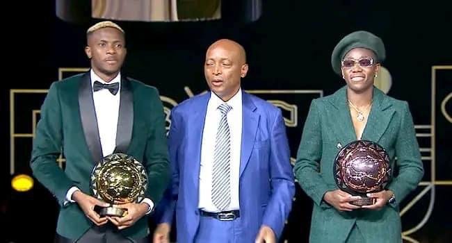 *The 2023 CAF men's and Women's footballers of the year, Victor Osimhen (L) and Asisat Oshoala (R), with the CAF President, Patrice Motsepe (M)