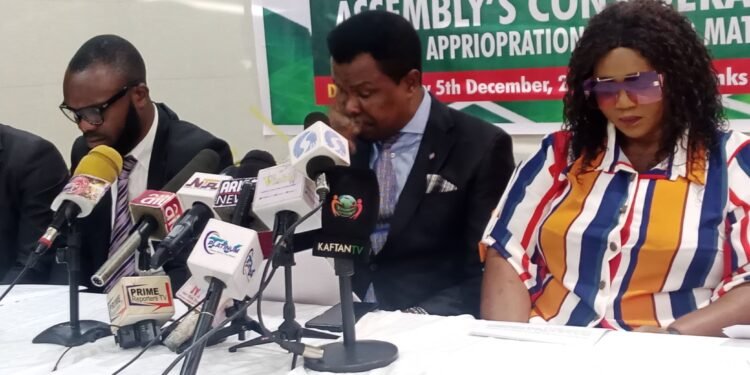 *The convener of the group, Lawrence Ngege, flanked members of the coalition ...during a press briefing in Abuja