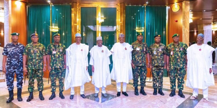 *President Bola Tinubu, flanked by NSA Nuhu Ribadu (r) and minister of defence (state) Bello Matawalle (l) and the service chiefs on both sides at the Presidential Villa, Abuja.