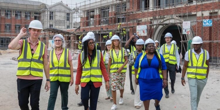 *Minister Kemi Badenoch (front middle) being conducted round the news schools project in Lekki axis of Lagos State, Nigeria by officials of the school — 12/02/2024