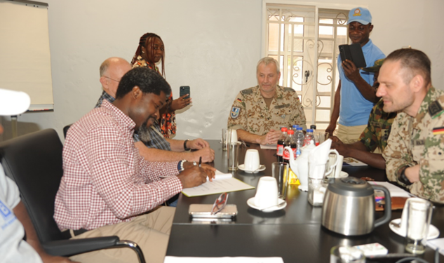 *   Picture Left: Head, Human Resources of Julius Berger Nigeria Plc, Olufemi Ojomo signing the MoU; Head, German Technical Advisory Group, Lt. Col. Frank Abel signing the MoU at the event.