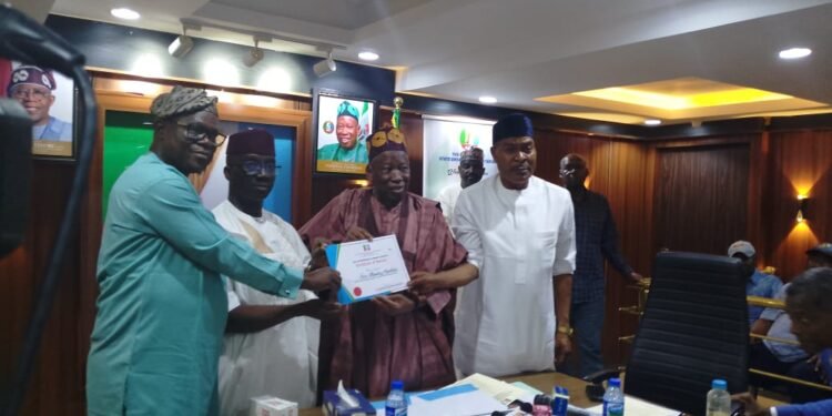*National Chairman of All Progressives Congress (APC), Dr. Abdullahi Ganduje (m) presenting certificate of return to the Party's governorship candidate for the Sept 21, 2024 governorship election Edo, Senator Monday Okpebholo (2nd left) in ABuja, Feb. 24, 2024