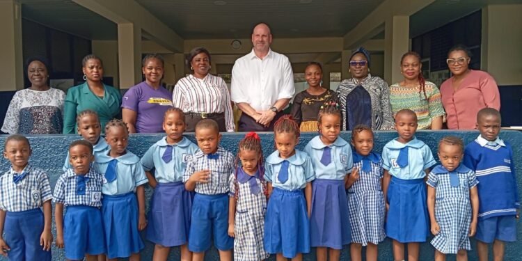 *Members of Julius Berger Team in a group photograph with some teachers and pupils of the Nursery School at the presentation of the Award recently.