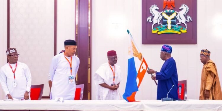 *President Bola Tinubu presents the APC flag to Senator Monday Okpebholo...18/3/2024