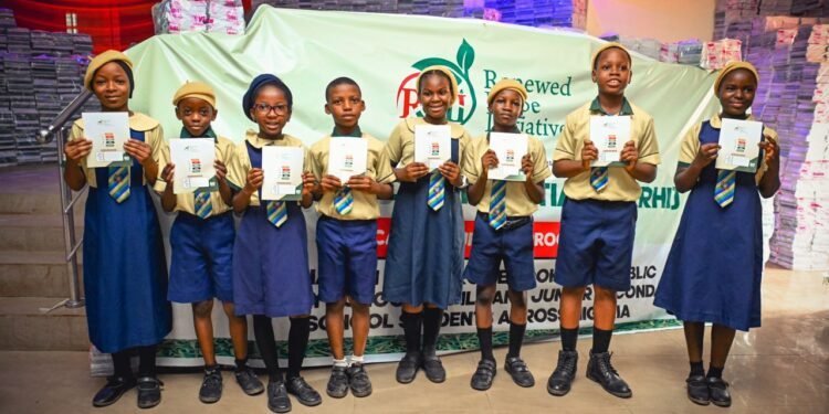 * A cross section of Pupils with the RHI Exercise Books after the flag- off of the distribution by the First Lady of the Federal Republic of Nigeria, Senator Oluremi Tinubu, CON in Abuja on Friday 15th March 2024