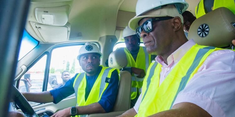 *Minister Olawale Edun test-driving one of the vehicles