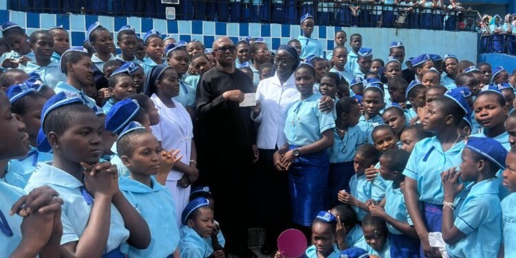 *•Peter Obi presenting the cheque to Holy Rosary Sisters’ students . . . Sunday  