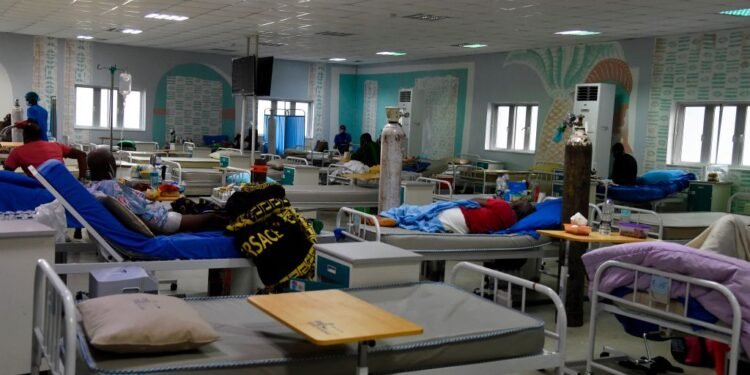 COVID-19 patients suffering from acute respiratory challenge lies on hospital bed at a male ward in Lagos State Isolation Centre, Yaba, Lagos on January 22, 2021. - The number of confirmed COVID-19 cases in Nigeria is increasing rapidly following daily reports by the Nigeria Centre for Disease Control (NCDC) even as  Lagos, Nigeria's commercial capital, accounted for the highest number of cases in the country. (Photo by PIUS UTOMI EKPEI / AFP) (Photo by PIUS UTOMI EKPEI/AFP via Getty Images)