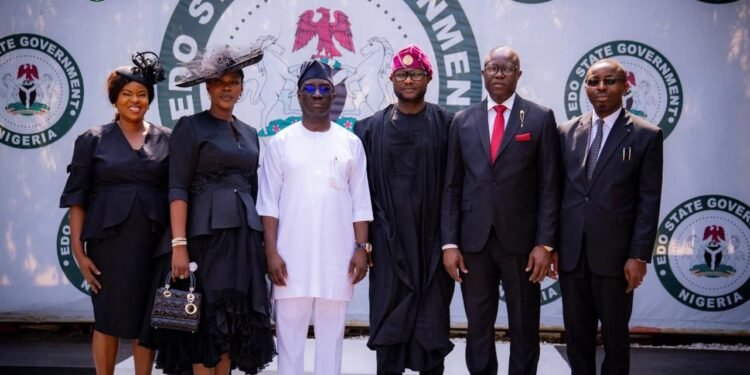 Gov Monday Okpebholo (3rd left) 
and the judges after the swearing-in ceremony