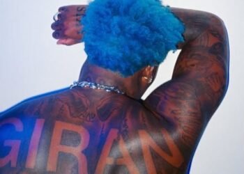 Asake Flaunts Tattoos And Muscles in Shirtless Photos