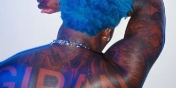 Asake Flaunts Tattoos And Muscles in Shirtless Photos