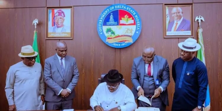 Gov Sheriff Oborevwori (m) signing the 2026 Appropriation Bill into law