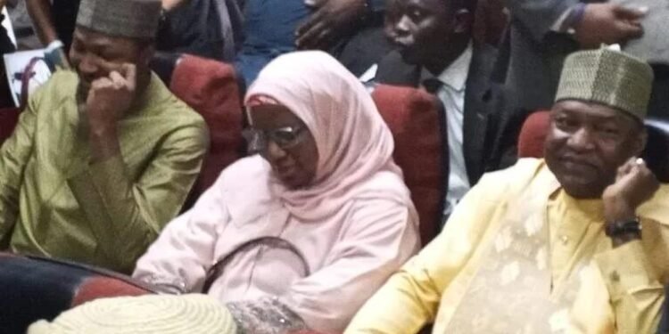 R-L: Former Attorney General and Minister of Justice, Abubakar Malami, wife and son