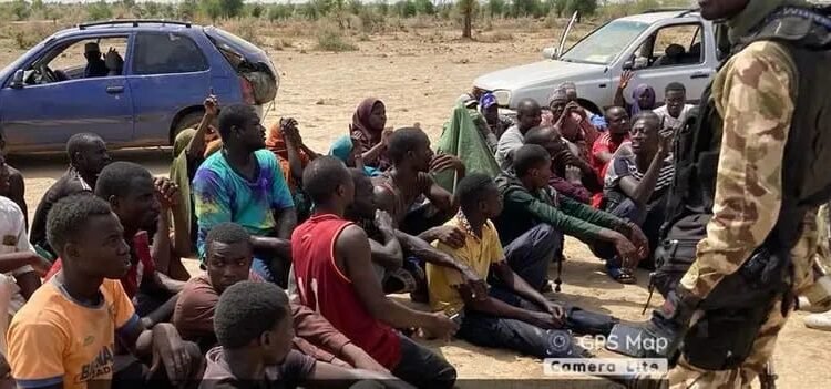 *The kidnapped victims and the troops that rescued them.