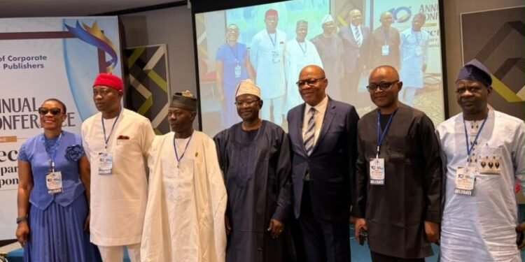 The president of the Guild of Corporate Online Publishers, alongside other dignitaries at its 10th annual conference in Lagos